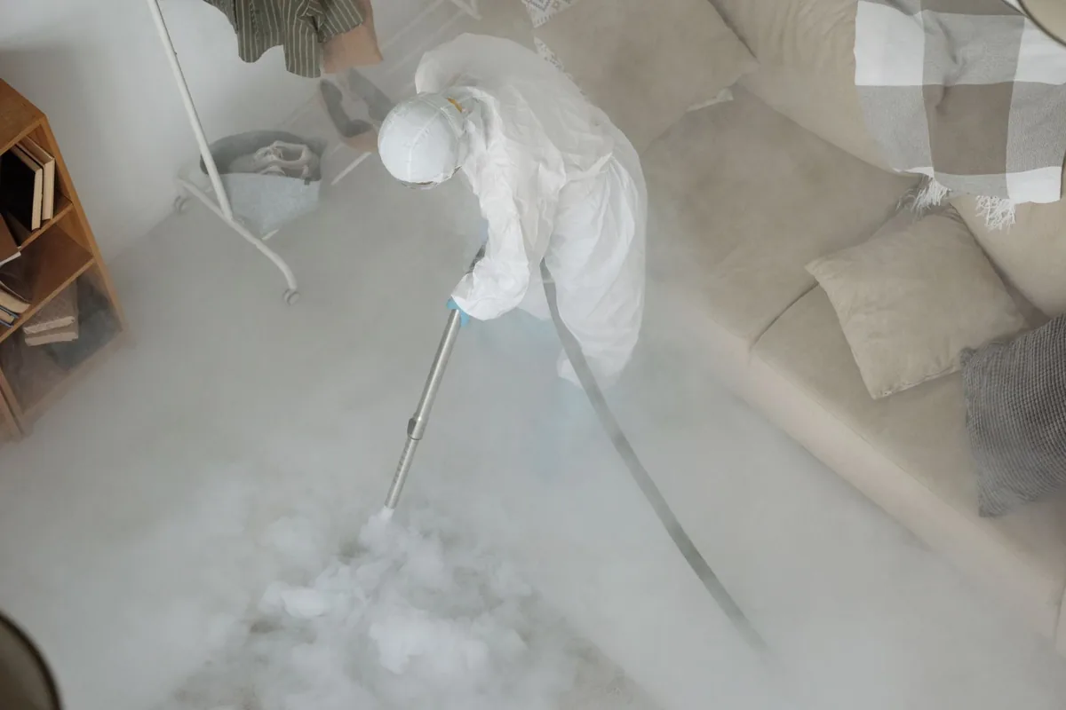 Biohazard cleanup technician in protective equipment, Grottoes, VA
